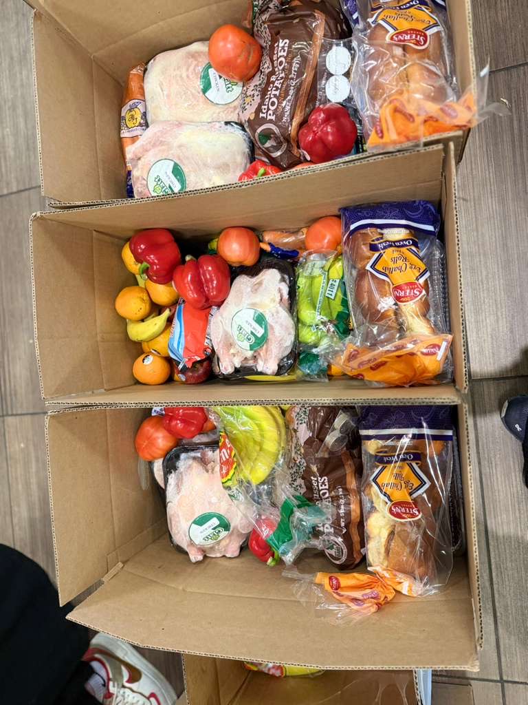 Three packed Shabbos boxes ready for delivery to families across Middlesex County